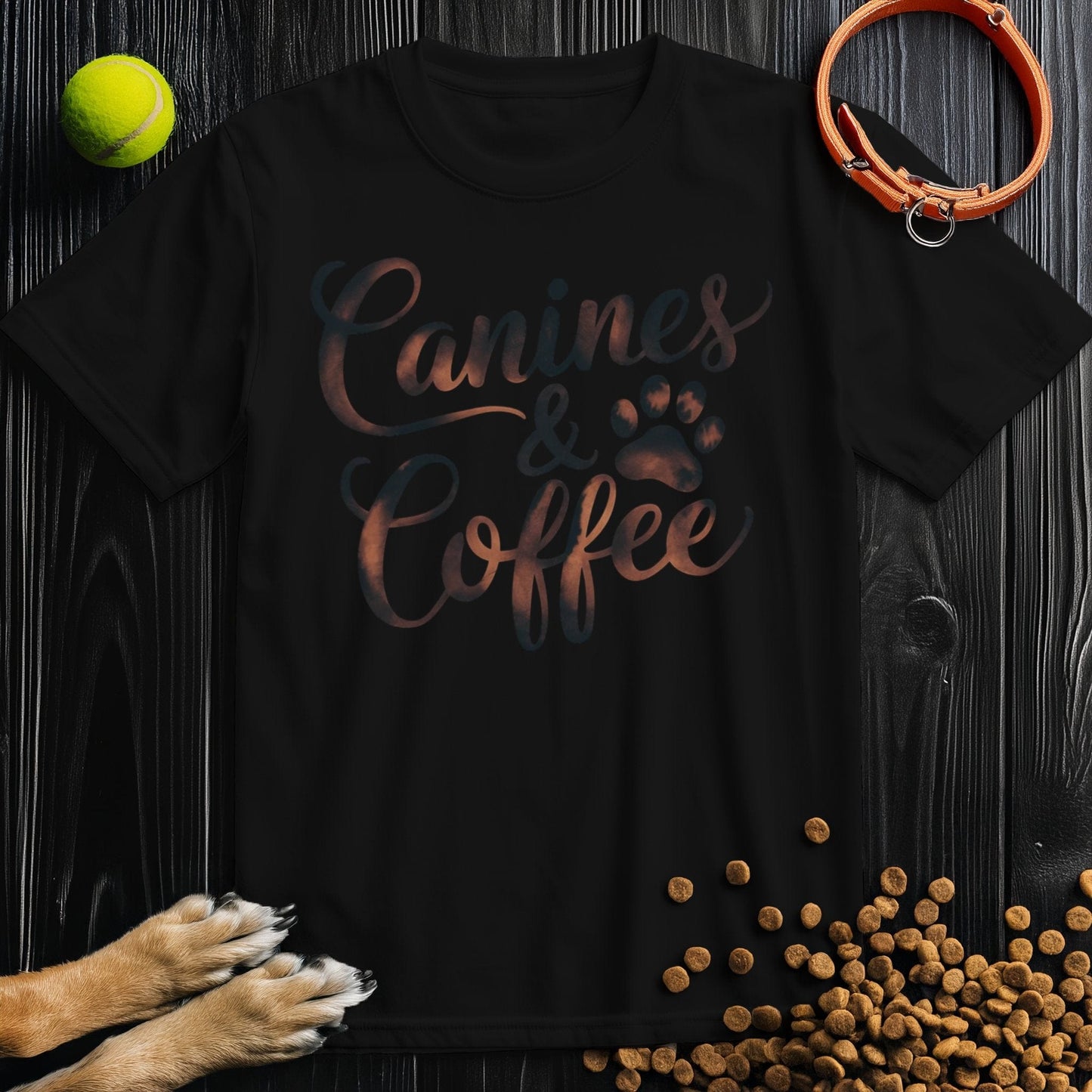 Black Canines & Coffee T-Shirt with bold lettering and paw print, crafted from 100% cotton for everyday wear and dog-themed fashion.