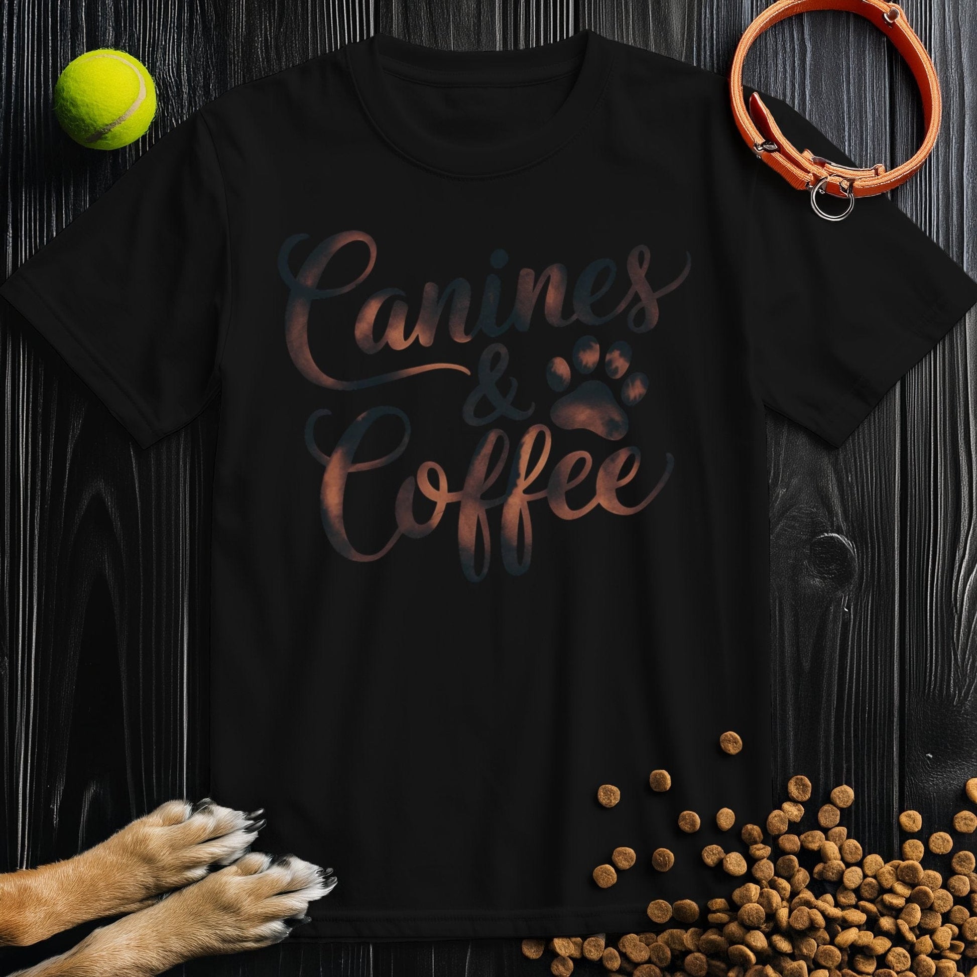 Black Canines & Coffee T-Shirt with bold lettering and paw print, crafted from 100% cotton for everyday wear and dog-themed fashion.