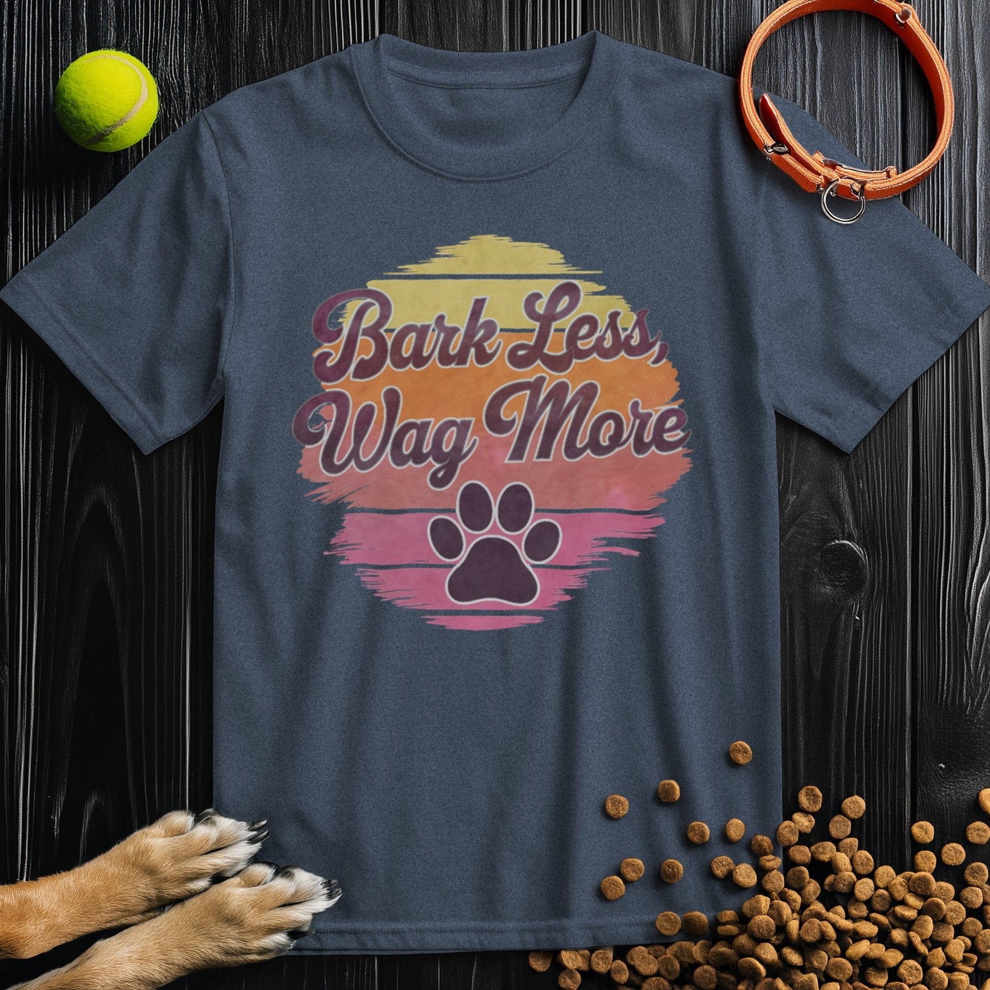 Navy Bark Less, Wag More T-Shirt with retro sunset and paw print graphic. Soft cotton tee ideal for dog enthusiasts, unisex style.