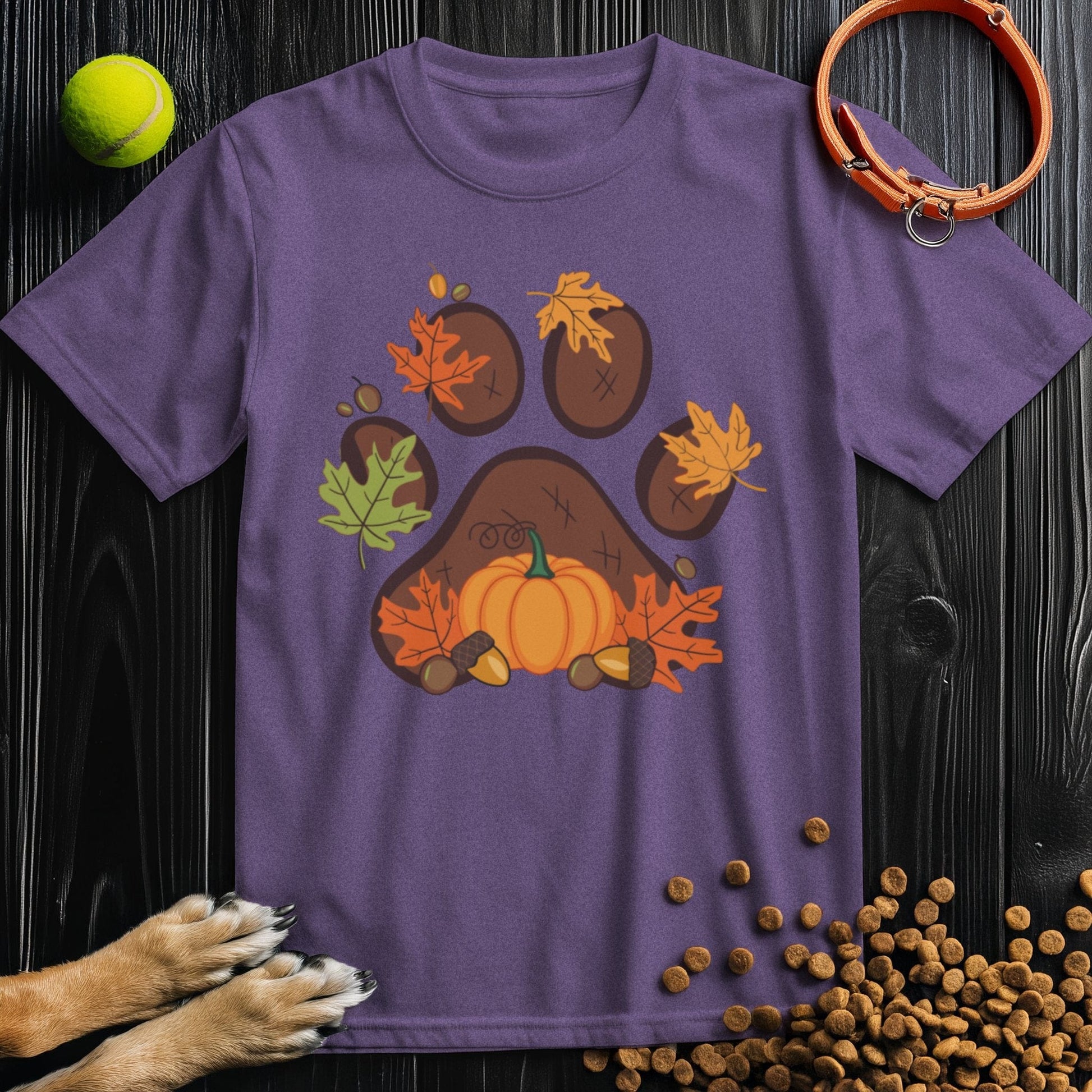 Purple Harvest Paw Prints dog t-shirt for humans with festive fall paw print and pumpkin graphic, made from sustainable cotton for comfort and style.