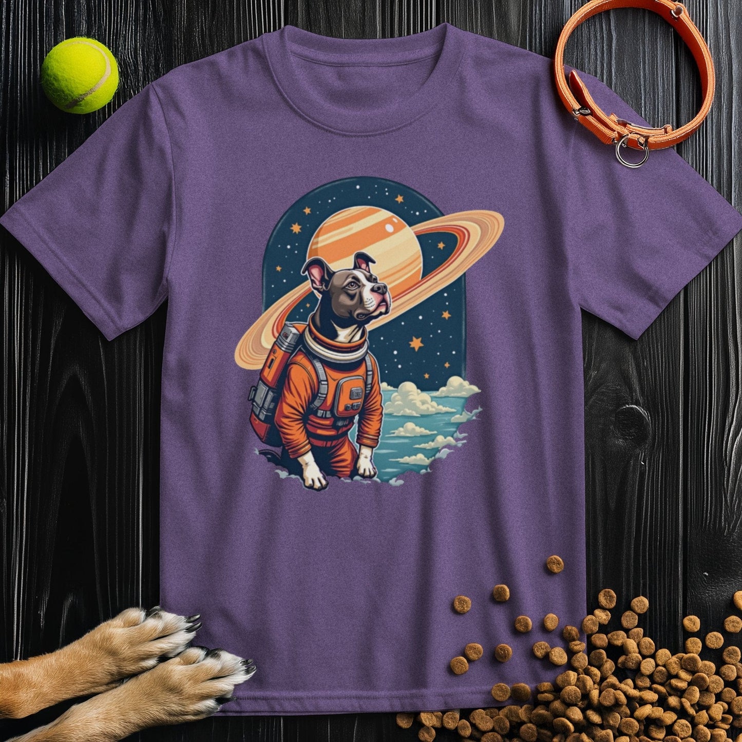 Purple Cosmic Canine T-Shirt with a vibrant dog astronaut print. A fun and cozy cotton tee for dog lovers and space fans alike.