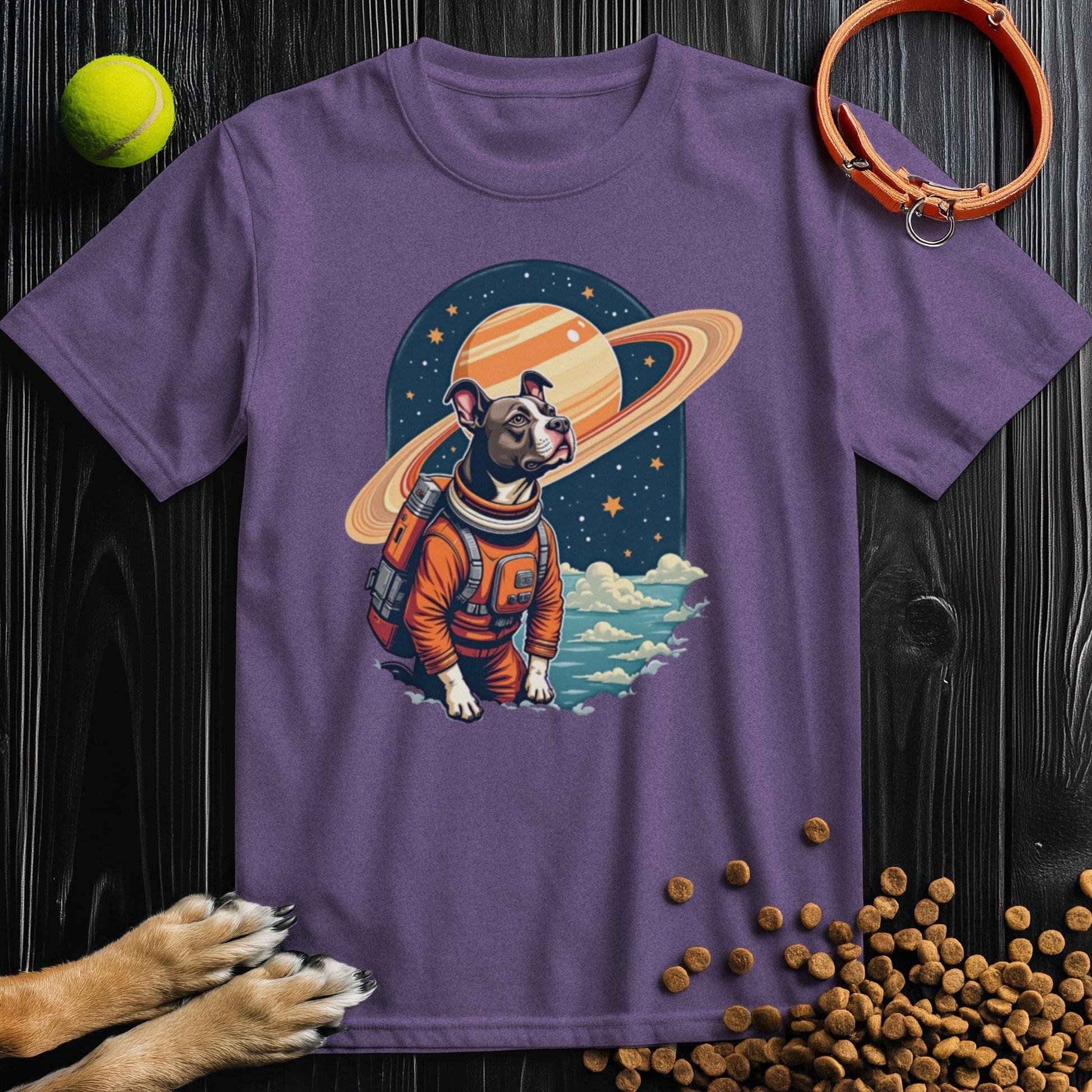 Purple Cosmic Canine T-Shirt with a vibrant dog astronaut print. A fun and cozy cotton tee for dog lovers and space fans alike.