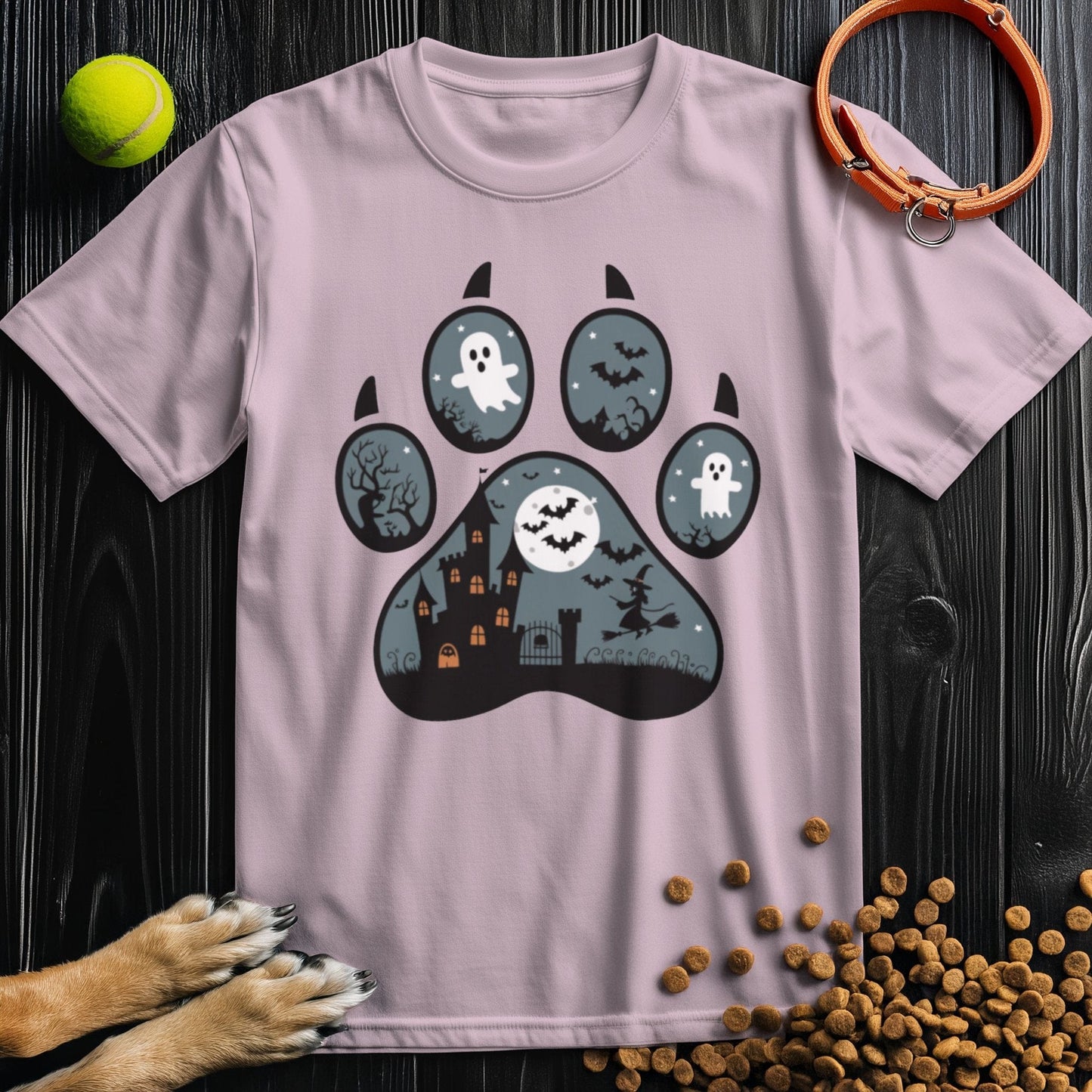 Light pink dog theme shirt with a Halloween paw print graphic. Soft, breathable cotton tee perfect for seasonal wear.