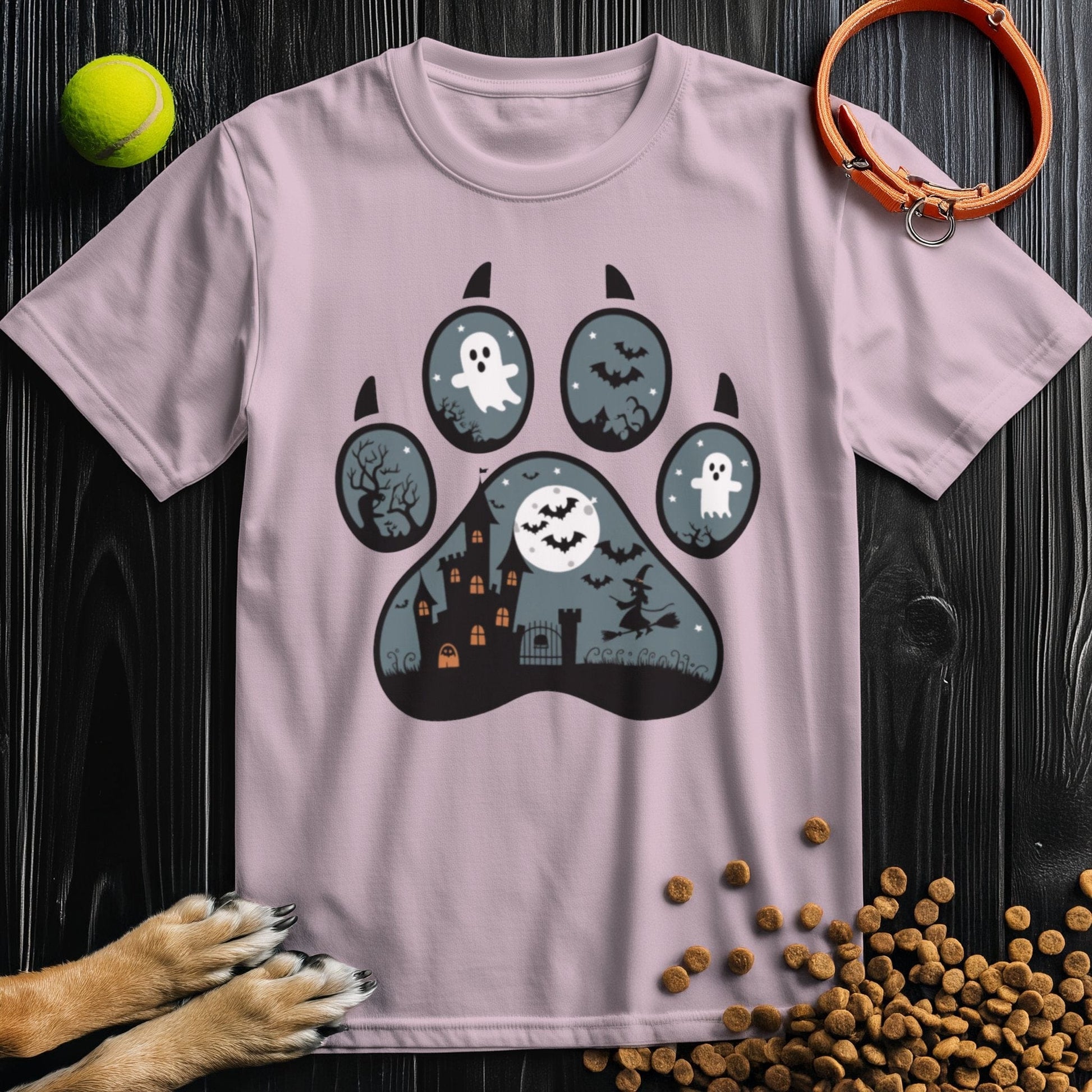 Light pink dog theme shirt with a Halloween paw print graphic. Soft, breathable cotton tee perfect for seasonal wear.