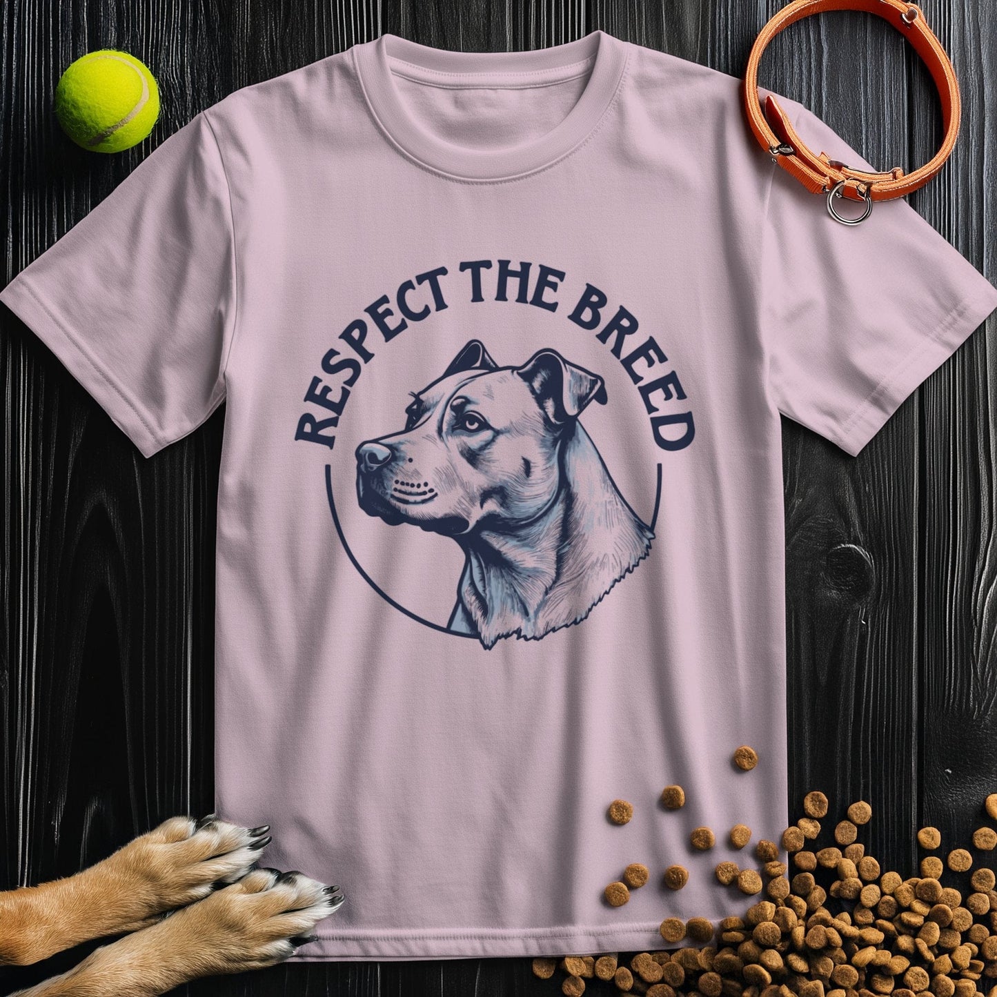 Light pink Respect the Breed T-Shirt with dog illustration and slogan. Unisex cotton shirt offering comfort and canine pride.