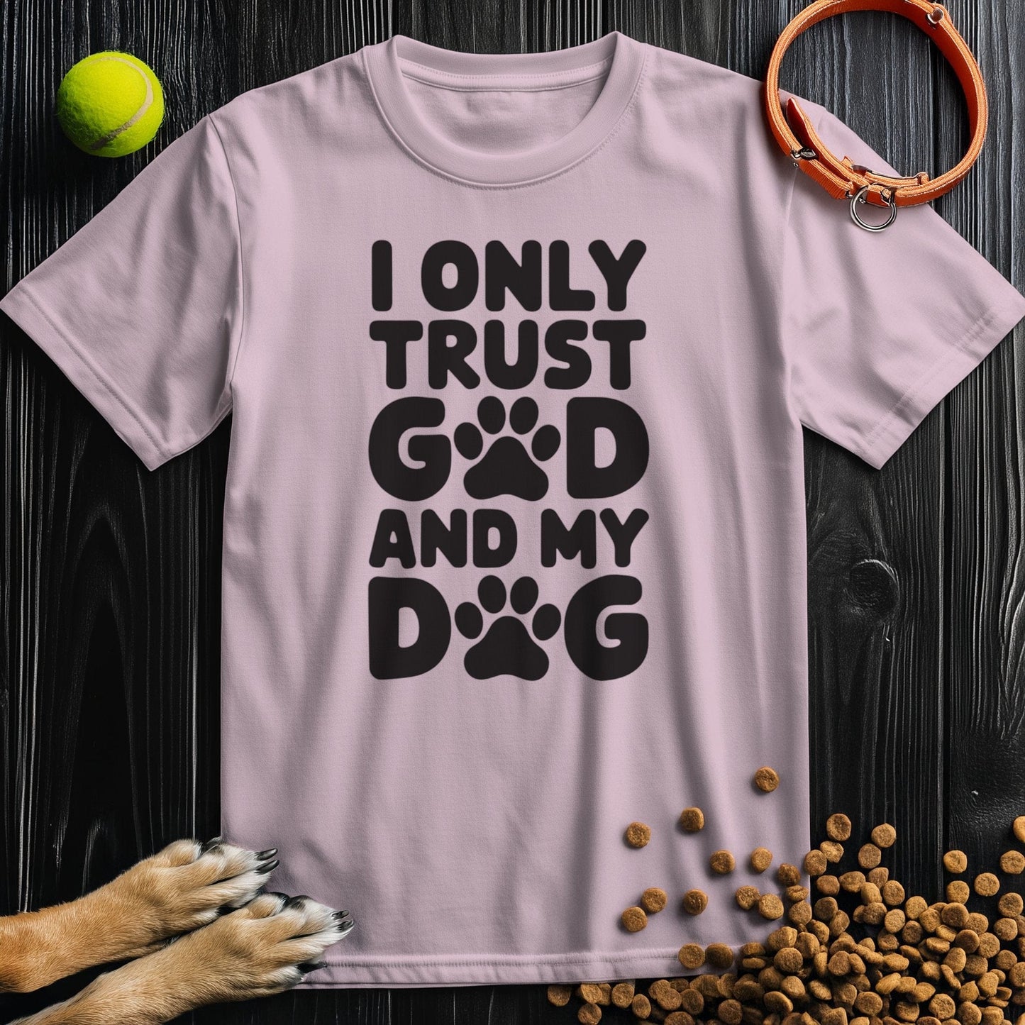 Light pink unisex cotton tee with black 'I Only Trust God and My Dog' text and paw prints. Stylish and ethical dog and god shirt for pet lovers.