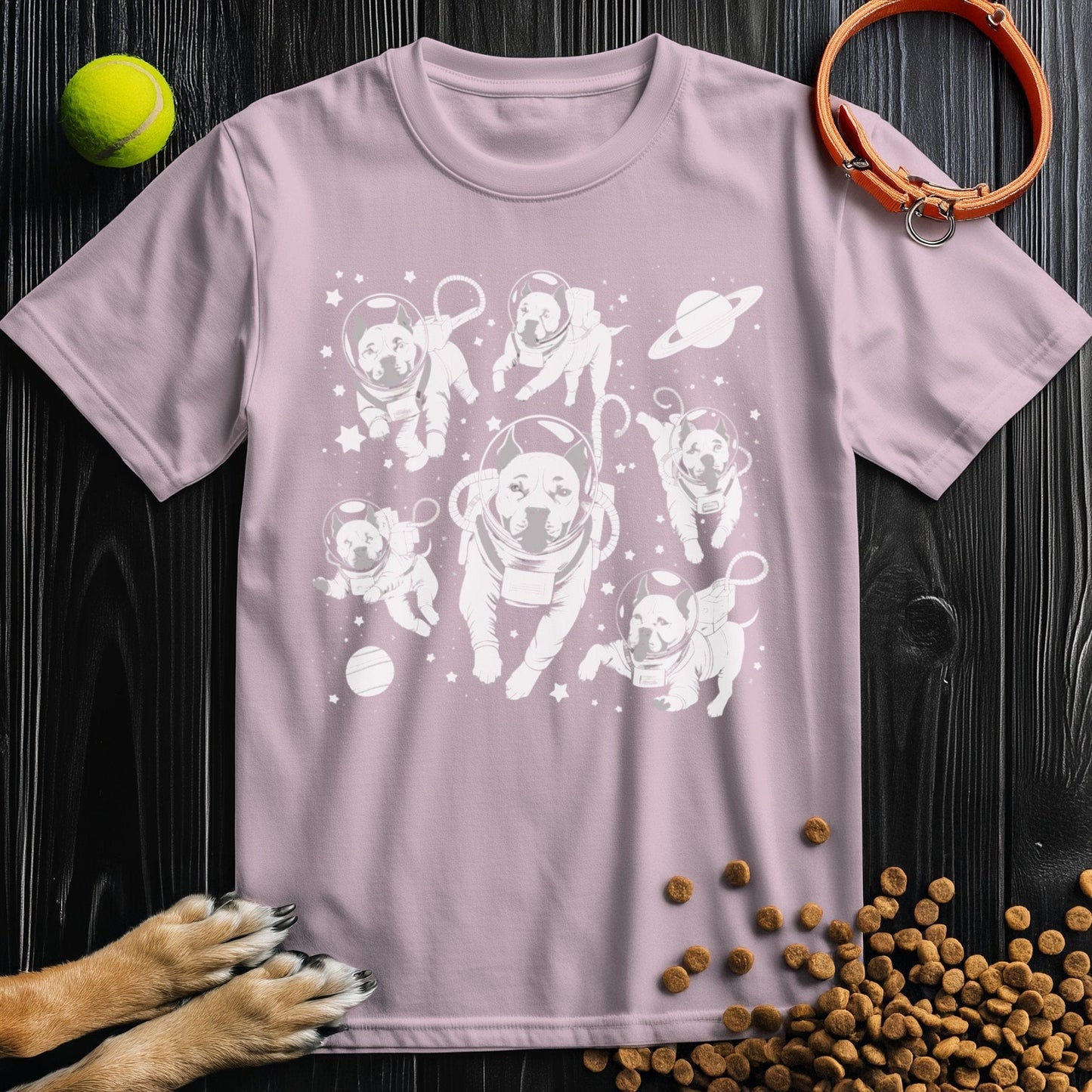 Light pink Interstellar Pits T-Shirt featuring adorable pitbulls in space suits. Ethical cotton tee for dog and space lovers.