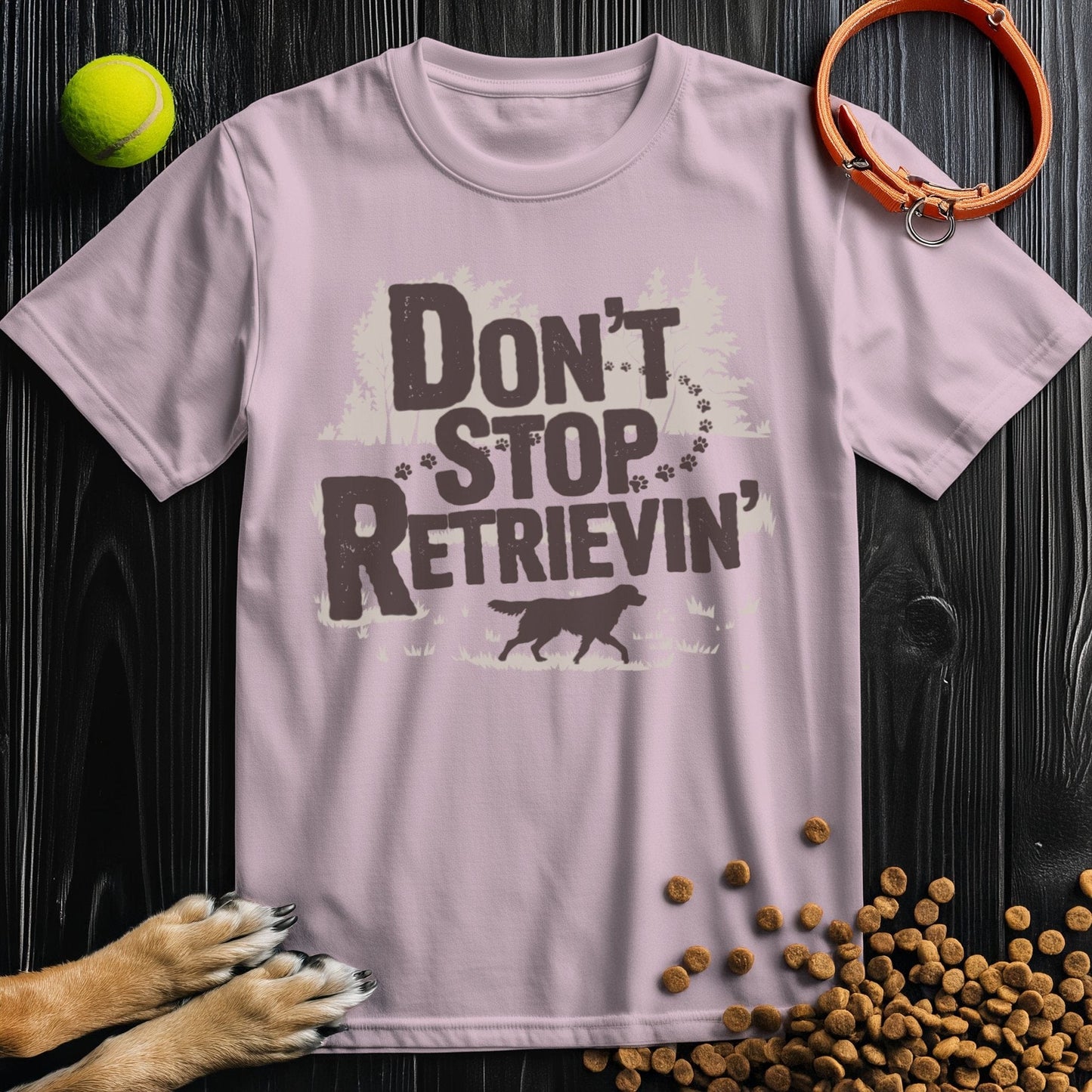 Light pink Don't Stop Retrievin' Adventure Edition T-shirt with dog and forest design, ideal for pet lovers seeking soft, stylish cotton tees.