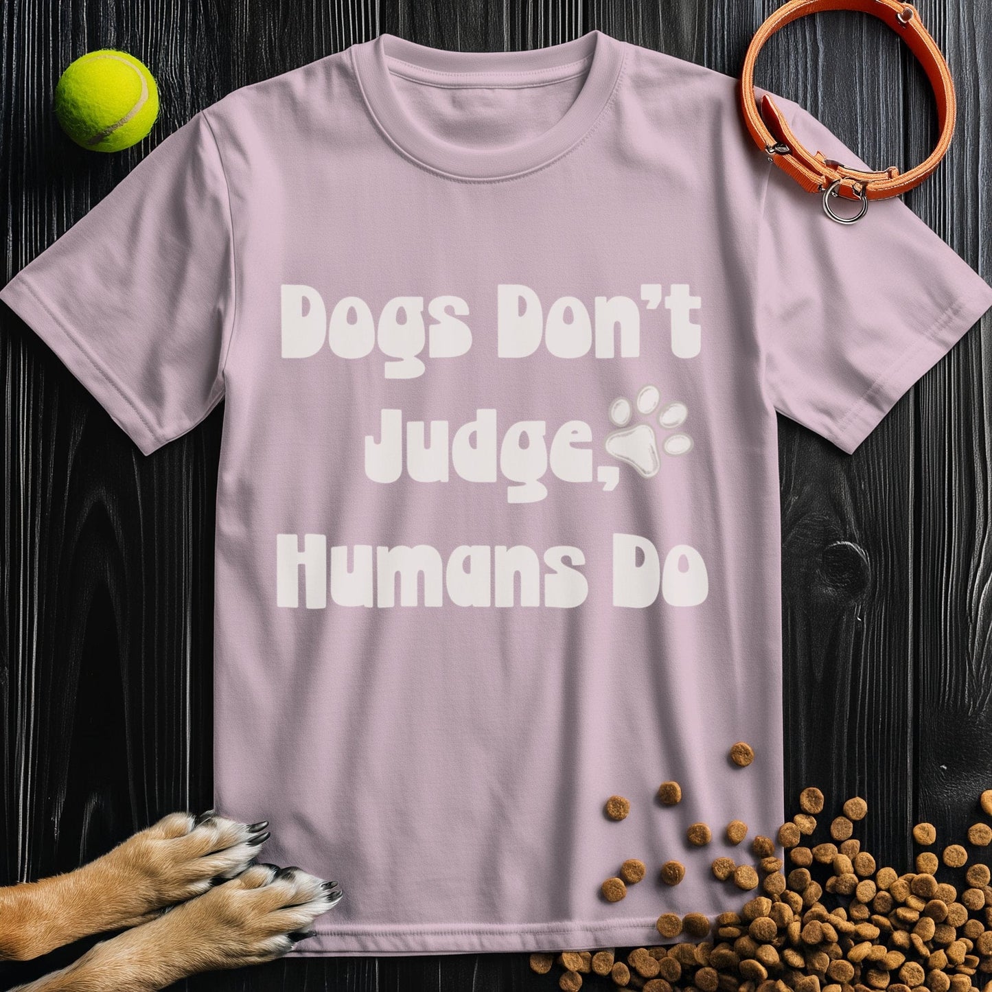 Light pink Ethical Dog TShirt with 'Dogs Don't Judge, Humans Do' slogan, sustainable cotton fabric, crew neck, regular fit.