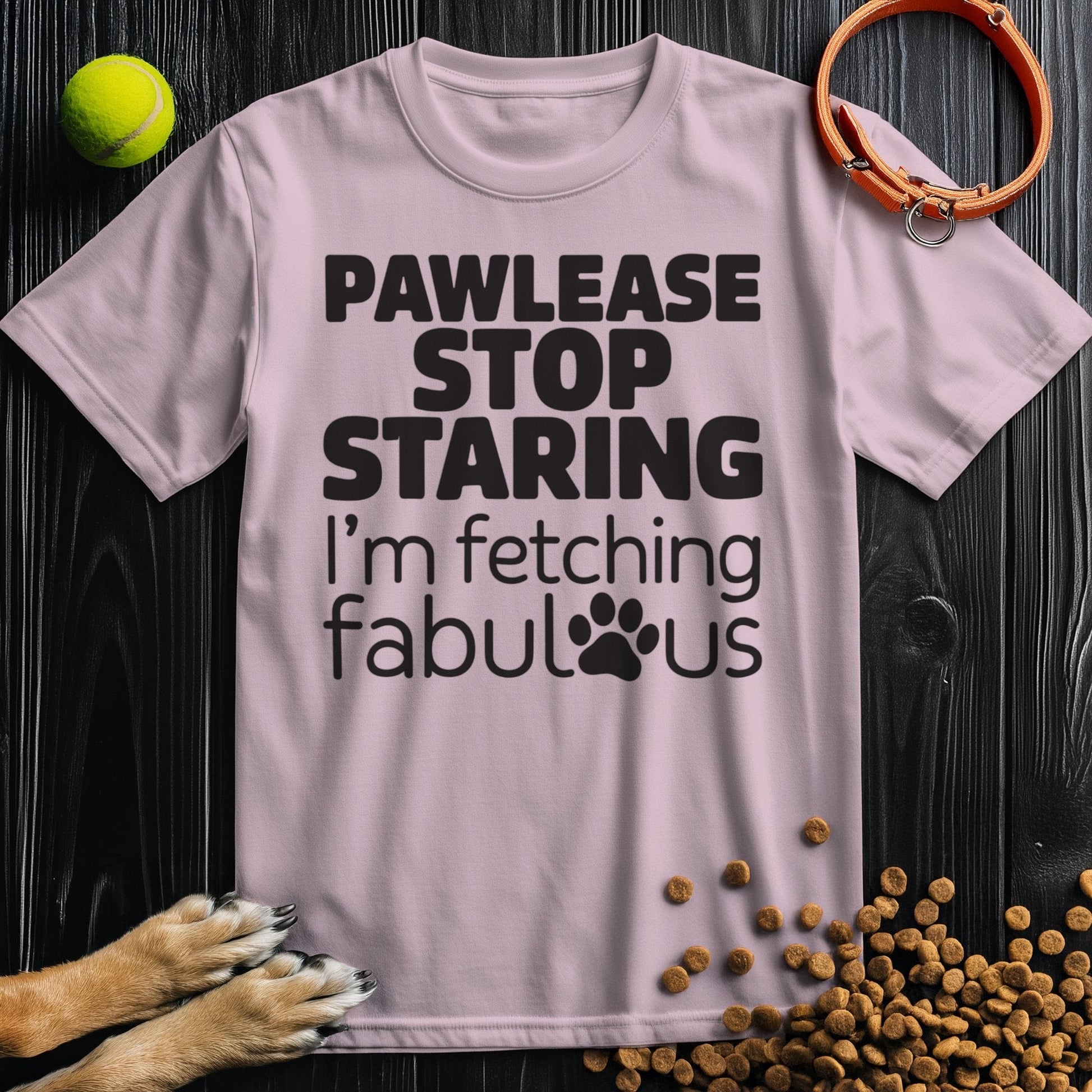 Light pink Fetching Fabulous T-Shirt with black dog pun design. Unisex cotton shirt combining comfort and playful pet-themed style.