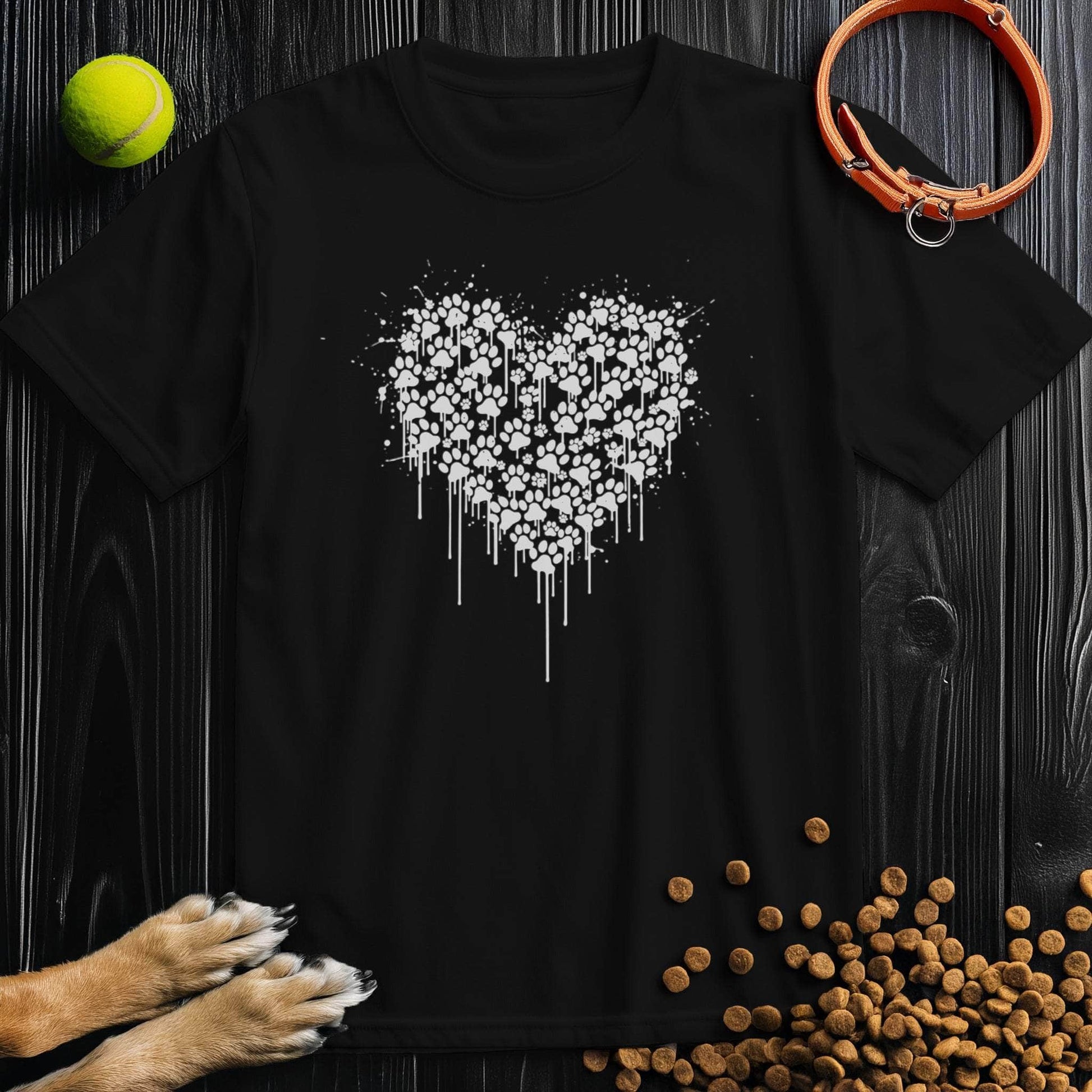 Black Pawstrokes T-Shirt featuring a white heart made of paw prints, perfect for dog lovers. Made from 100% cotton for comfort and durability.