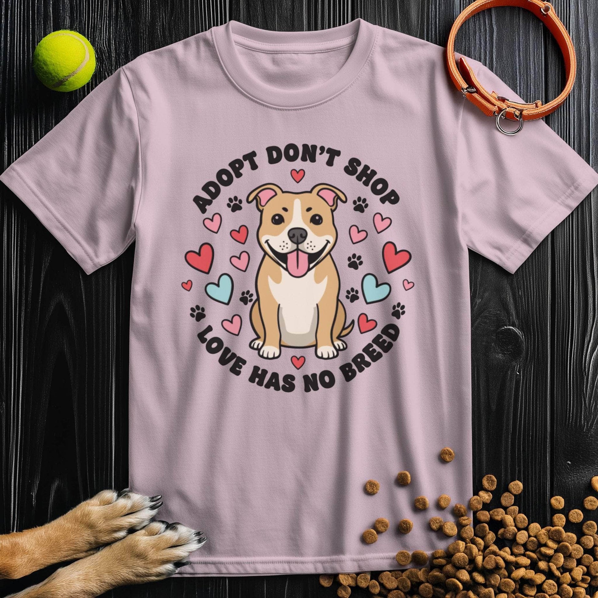 Adopt Don't Shop Tee in pink with cartoon dog and hearts, 100% cotton ethical graphic dog t-shirt for pet lovers.