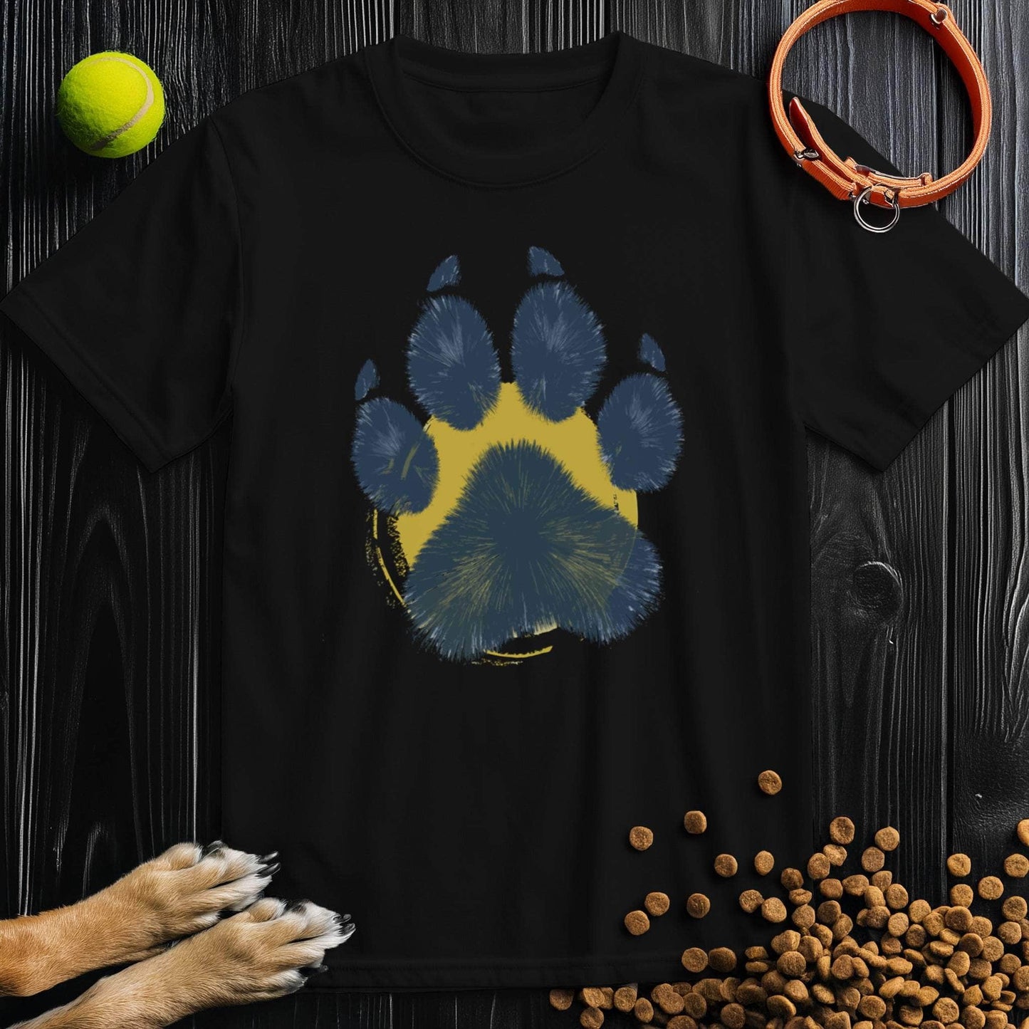 Black Painter’s Paw T-Shirt with artistic blue paw print on yellow background. Stylish unisex dog lover shirt made from soft 100% cotton.