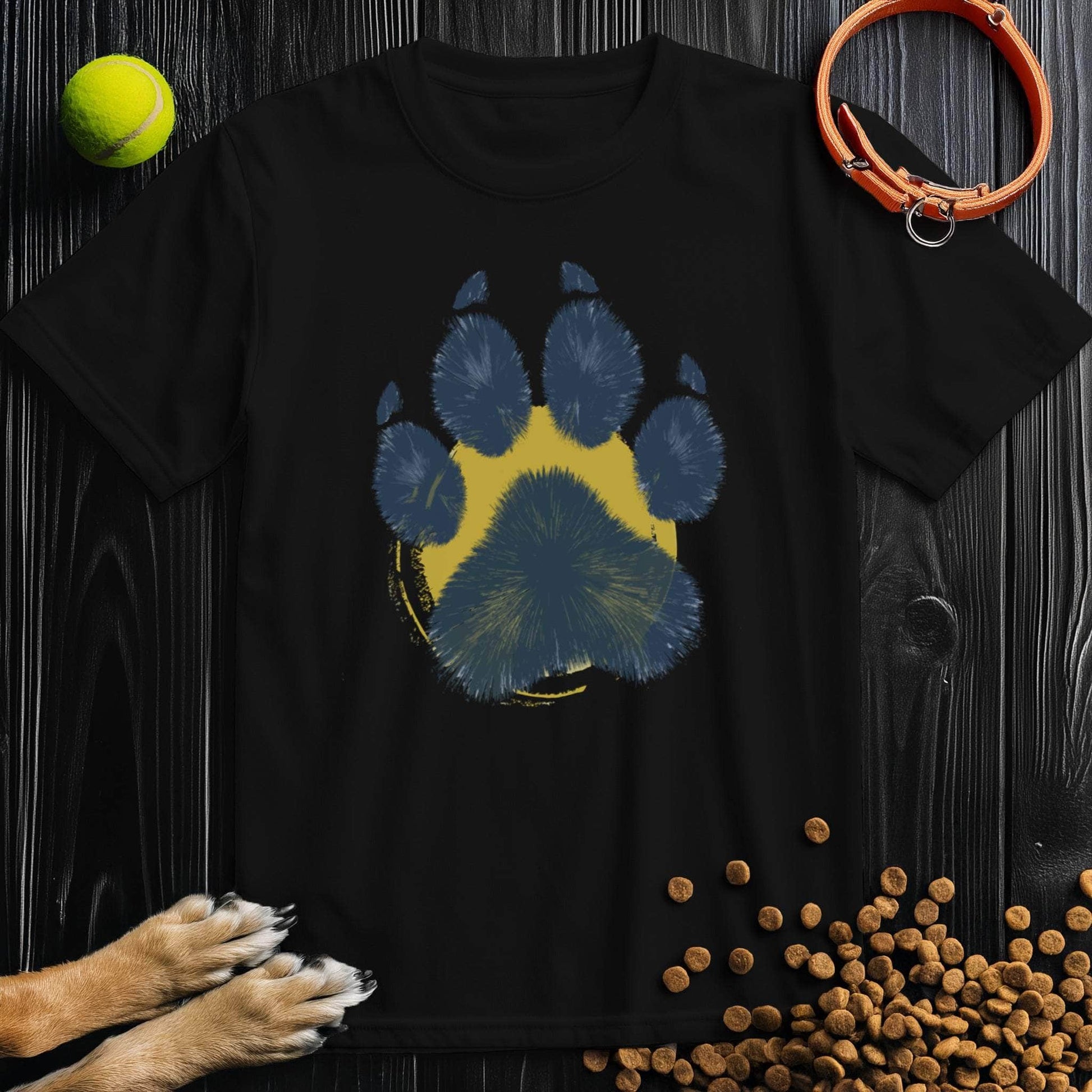 Black Painter’s Paw T-Shirt with artistic blue paw print on yellow background. Stylish unisex dog lover shirt made from soft 100% cotton.