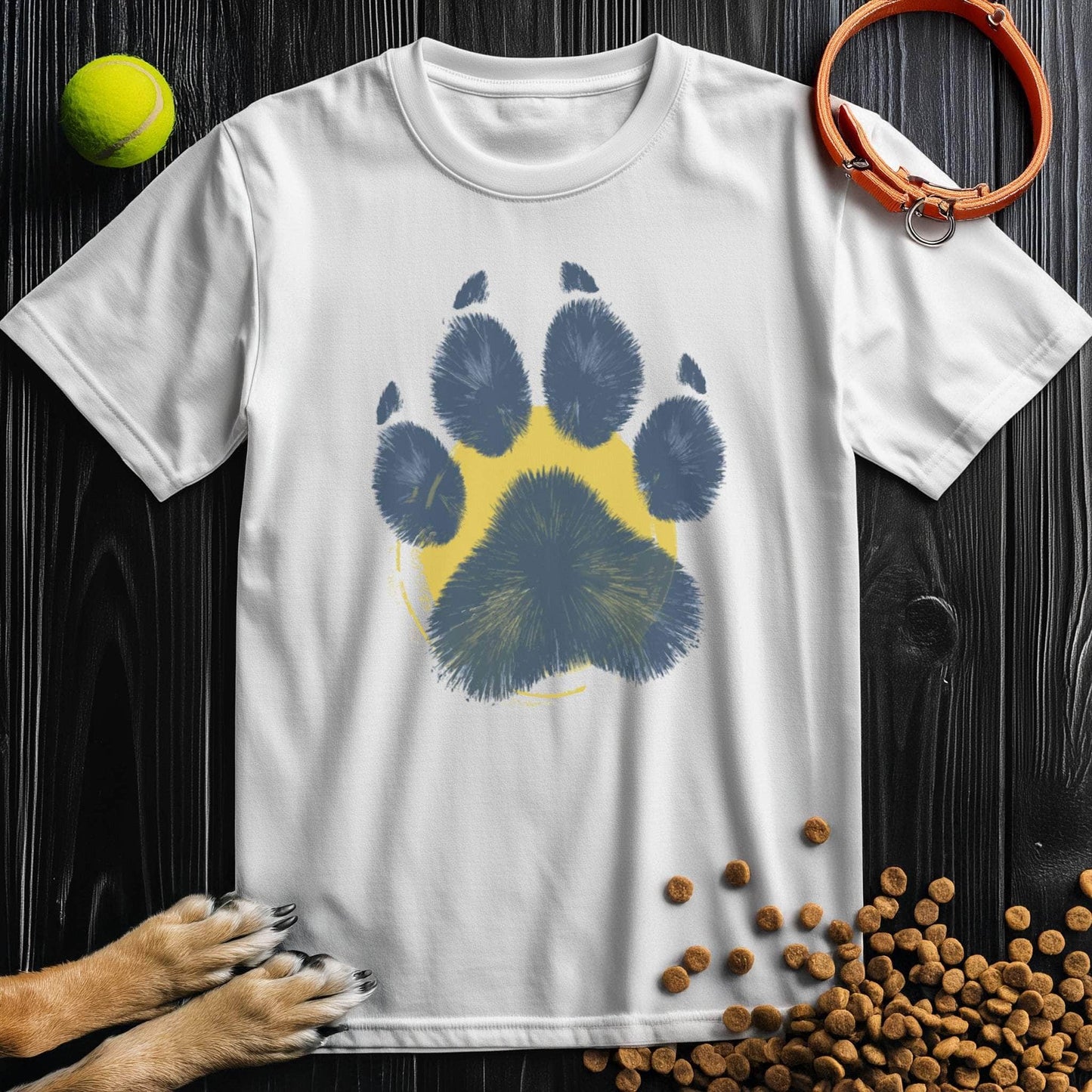White Painter’s Paw T-Shirt featuring bold blue paw print over yellow circle. Unisex cotton tee ideal for dog lovers and everyday comfort.