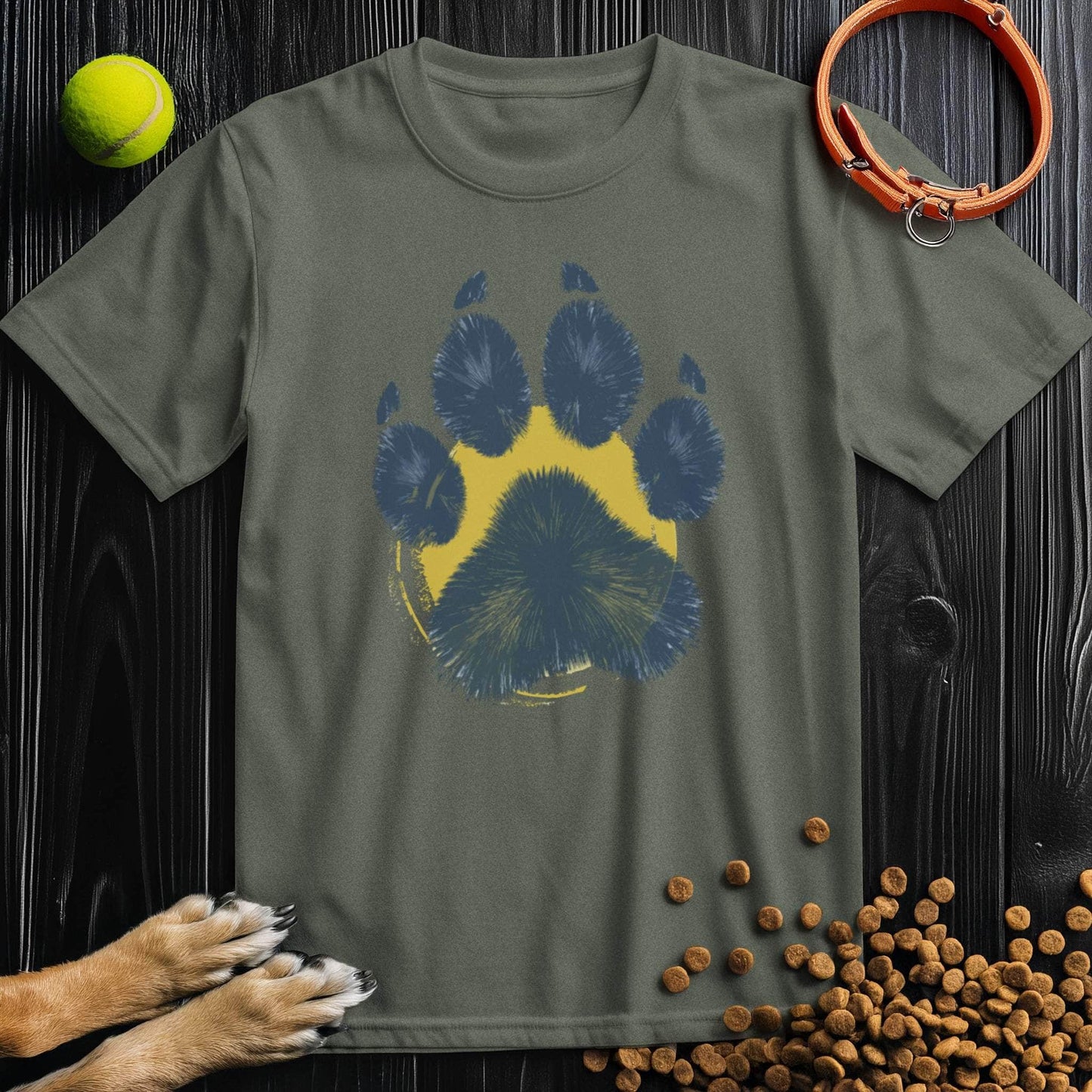 Olive green Painter’s Paw T-Shirt with bold blue and yellow paw print. 100% cotton unisex tee, perfect for dog lovers and everyday outfits.