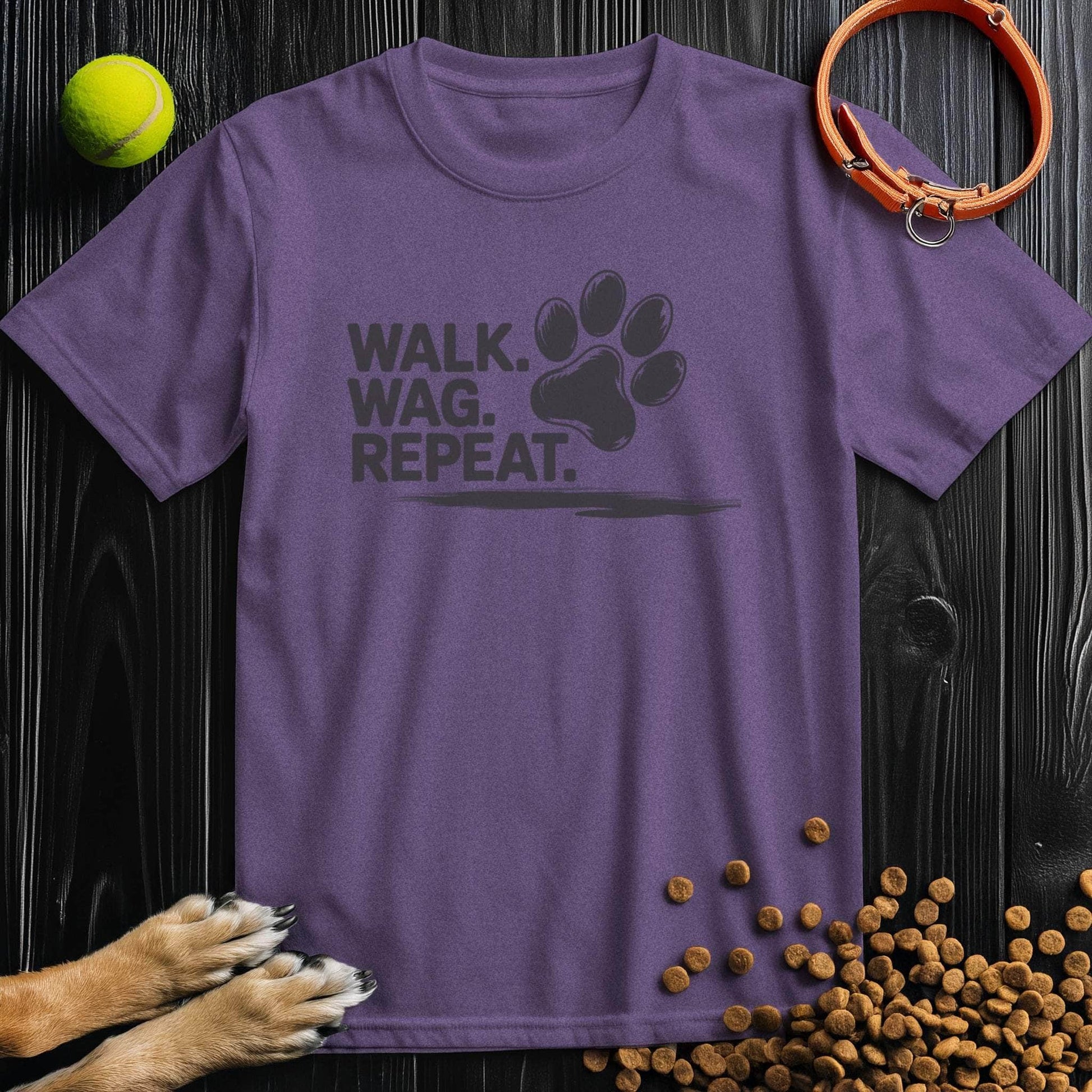 Purple Walk Wag Repeat T-Shirt for dog lovers, showcasing a black paw print design on soft cotton, great for casual wear.